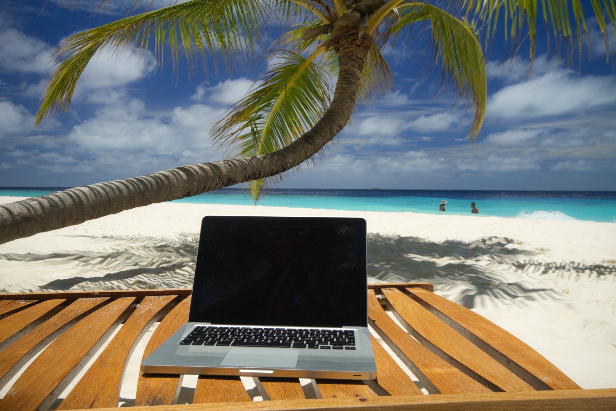 laptop sitting on beach chair